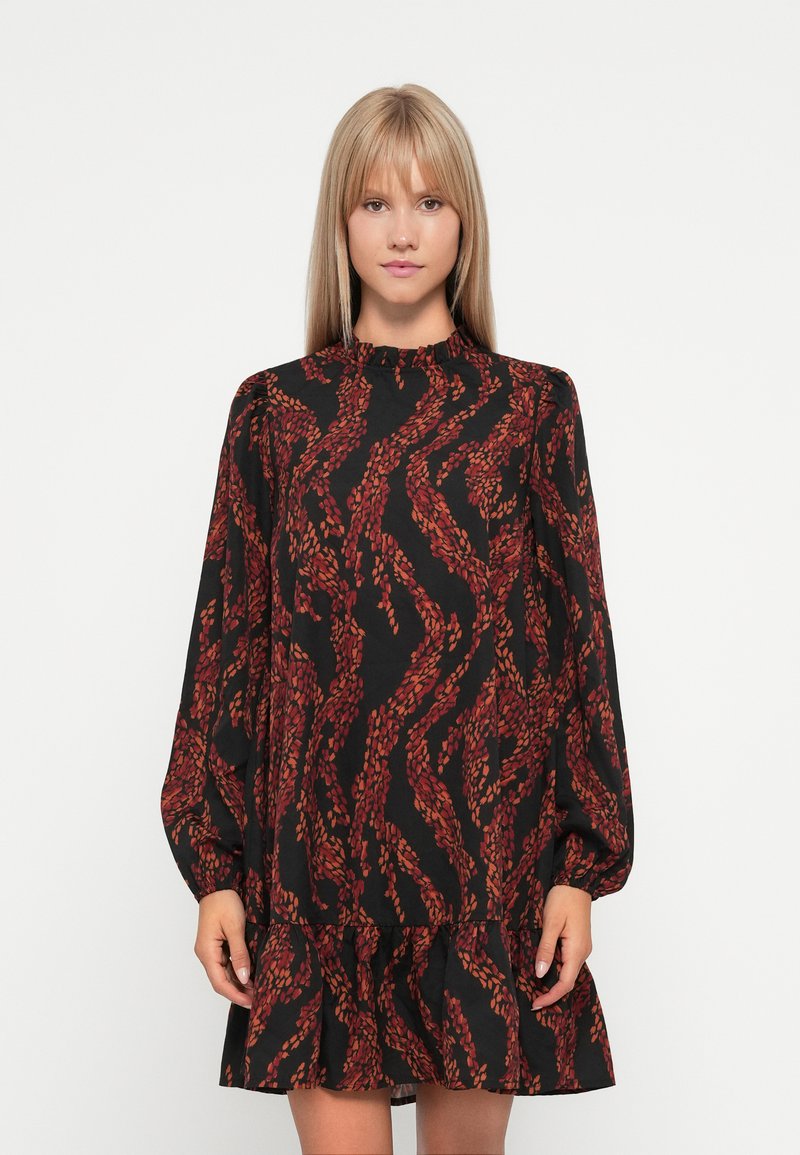 Black dress with long puff sleeves, featuring a ruffled neckline and a tiered hem. Red and orange leafy pattern throughout the fabric.
