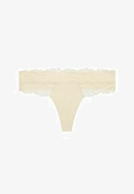 Tanga de encaje beige con bordes festoneados y un delicado patrón floral en la cintura.