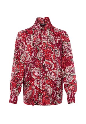 Long-sleeve blouse with red, white, and black floral paisley pattern and a large necktie bow on a plain white background.