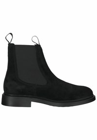 Bottines Chelsea en daim noir avec des panneaux élastiques sur les côtés, semelle en caoutchouc plate et tirettes au talon pour un enfiler facile.