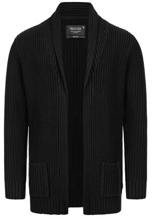 Black knitted cardigan featuring a ribbed texture, open front, two front pockets, and a relaxed fit.