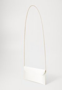 White clutch bag made of smooth fabric, featuring a fold-over flap and a gold chain strap. The design is rectangular with clean lines.