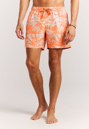 Shorts de bain orange avec un motif de feuilles de palmier beiges. Confectionnés dans un tissu léger, ils disposent d'une taille élastique et d'un cordon de serrage ajustable.