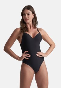 Costume da bagno intero nero con scollatura a V profonda. Presenta spalline regolabili e un tessuto liscio ed elastico, che offre una vestibilità aderente.
