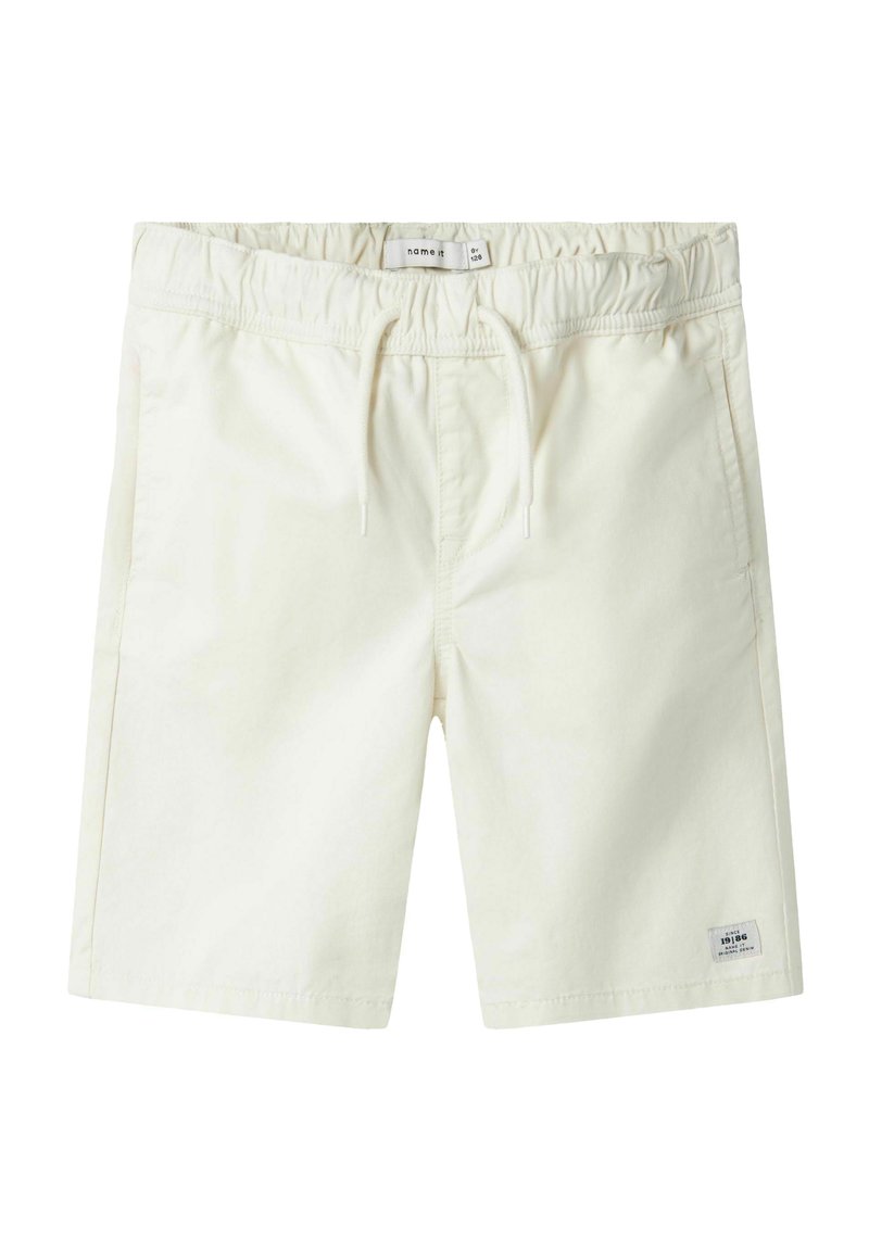 Crème-kleurige shorts gemaakt van zachte katoen, met een elastische tailleband en een trekkoord, zijzakken en een klein logo-patch.