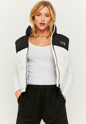 ÄRMELLOSE STEPP - Waistcoat - black