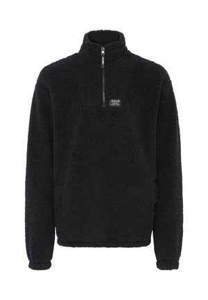 Zwarte fleece pullover met een hoge kraag, een halve rits aan de voorkant, elastische manchetten en een vierkante logo patch op de borst. Getextureerde, zachte stof.