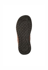 Brown leather shoe sole with a textured, black rubber bottom. Features a geometric tread pattern for traction. Thick and durable construction.