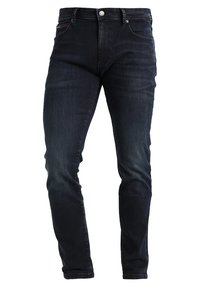 Tmavě modré džíny s slim fit, s předními kapsami, jedním knoflíkem a jemnými detaily opotřebení na nohavicích.