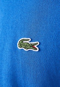 Lacoste Pikeepaita - bleu