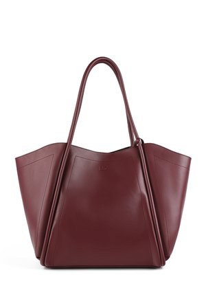 Large burgundy leather tote bag with two long handles, angular design, smooth texture, and subtle embossed logo on the front.