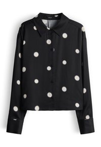 Zwart langarig shirt met witte stippen, voorzien van een kraag en een knoopsluiting aan de voorkant, gemaakt van een gladde stof met een losse pasvorm.