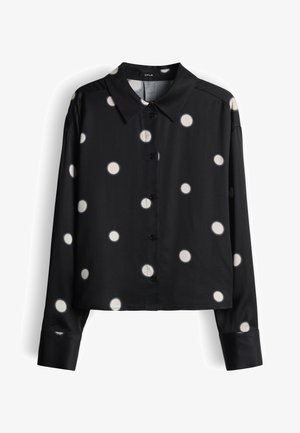 Zwart langarig shirt met witte stippen, voorzien van een kraag en een knoopsluiting aan de voorkant, gemaakt van een gladde stof met een losse pasvorm.
