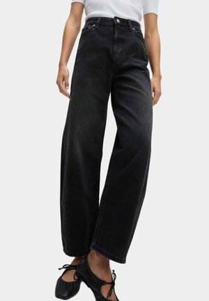 Zwarte wijde jeans van denim, met een hoge taille, sluiting met een knoop aan de voorkant en een vijf-pocket ontwerp met een licht vervaagde textuur.