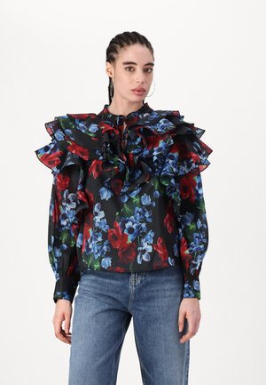 Black floral blouse with large ruffled collar, featuring red and blue flowers. Long, semi-transparent sleeves with buttoned cuffs. Casual fit.