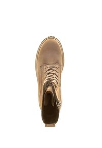 Botte chelsea en cuir marron avec lacets et fermeture éclair latérale, bout rond et surface texturée. Semelle en caoutchouc avec un motif pour une bonne adhérence.