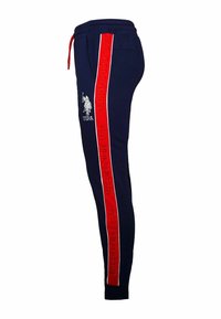Navy jogger pants with red side stripes featuring "U.S. POLO ASSN" text. Includes an elastic waistband with a drawstring and a horse logo.