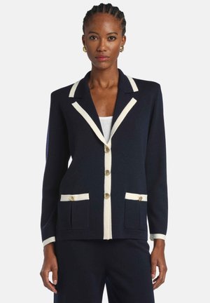 Navy blazer with cream trim, gold buttons, and two front pockets. Designed with a structured fit and notch lapels.