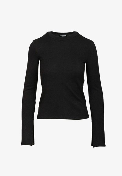 Maglietta nera a maniche lunghe, aderente, con scollatura a girocollo, leggermente svasata all'orlo e piccoli spacchi ai polsini.