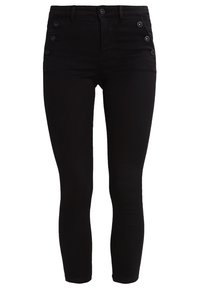 Černé džíny skinny s vysokým pasem, s pěti knoflíky na levé straně a hladkou texturou. Bez viditelných ozdob.