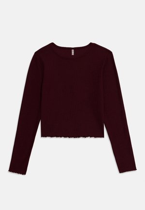 Top cropped de manga longa em tecido canelado de um profundo burgundy, com decote redondo e bainha assimétrica. Textura suave com design ajustado.