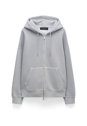 Lichtgrijze hoodie met rits, gemaakt van zachte stof, voorzien van een ruime voorzak, capuchon met trekkoord en geribbelde manchetten en zoom.