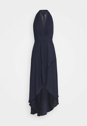 Robe bleu marine à encolure halter avec incrustation en dentelle, taille cintrée et ourlet asymétrique. Fabriquée en tissu doux avec une silhouette fluide.