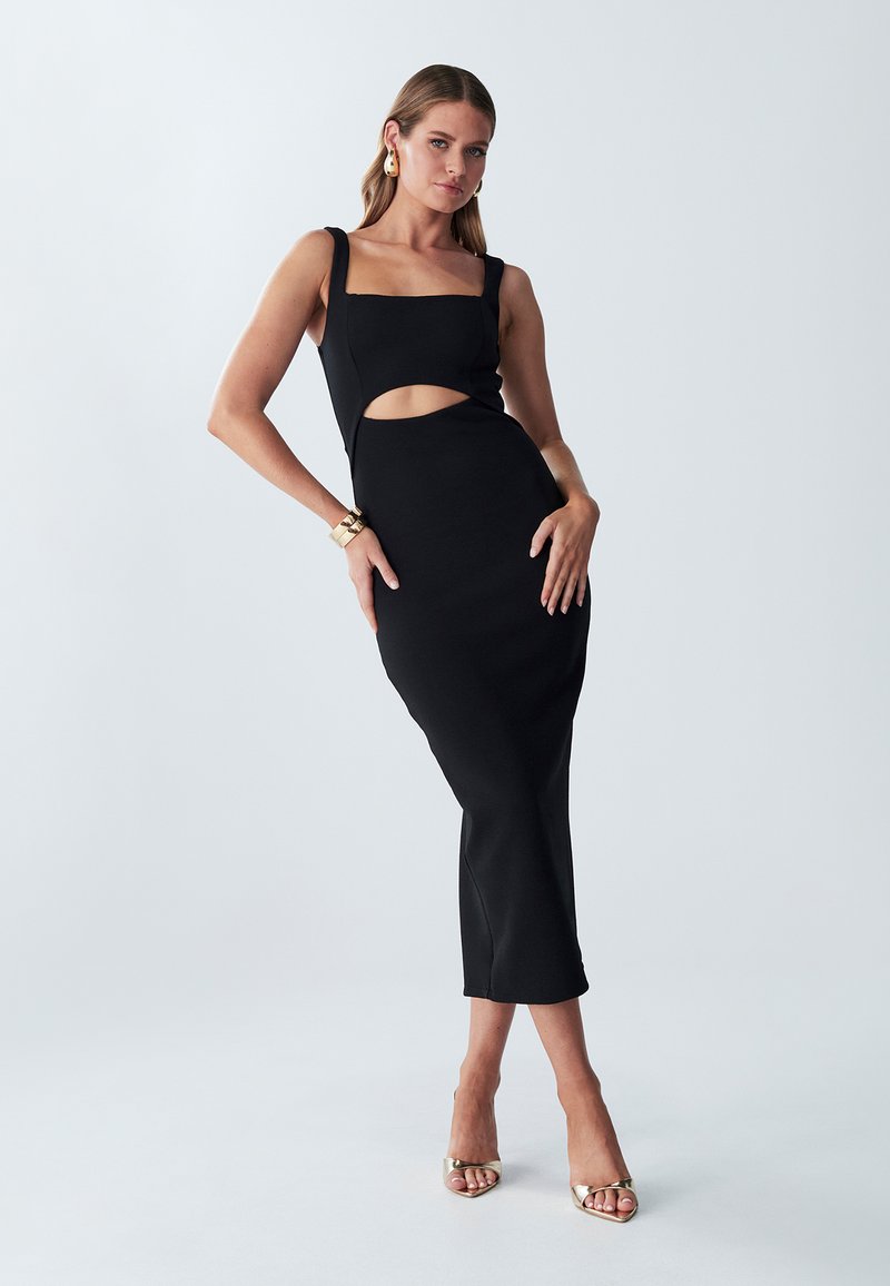 Black midi dress with a square neckline, cut-out detail at waist, and fitted silhouette. Features thick straps and smooth texture.