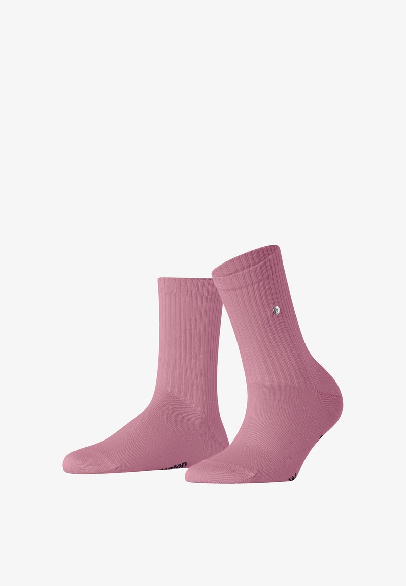 Pink ribbed crew socks with a textured surface, featuring a logo accent near the ankle and a reinforced toe and heel for durability.