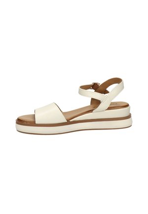 White leather open-toe sandal with ankle strap, cushioned tan insole, and thick white sole with brown trim.