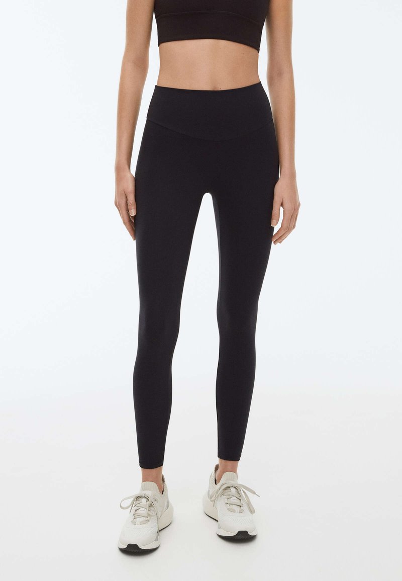 OYSHO MATERNITY COMFORT Leggings Hosen black/schwarz Zalando.de