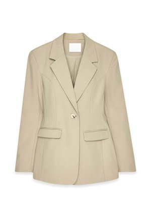 Beige bleiser, jossa on jämäkkä muotoilu, kaksi etutaskua, yksinkertainen nappisulkumekanismi ja teksturoitu kankaan pinta.