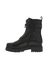Bottines noires avec une finition en cuir lisse et brillant, des doubles zips et une semelle à crampons épaisse. Présente un accent cousu sur la semelle.