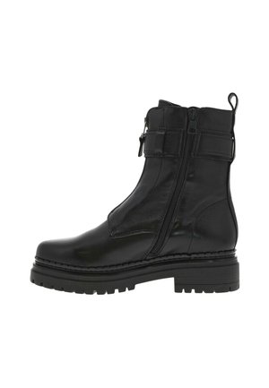 Bottines noires avec une finition en cuir lisse et brillant, des doubles zips et une semelle à crampons épaisse. Présente un accent cousu sur la semelle.