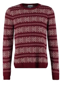 Pull en tricot bordeaux avec un motif flocon de neige blanc, col rond, manches longues, et poignets et ourlet côtelés pour une finition texturée.