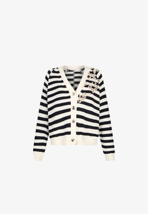 Cardigan a righe bianche e nere con scollo a V, quattro bottoni d'argento e dettagli in pizzo floreale sul lato superiore sinistro.