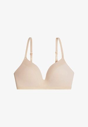 Sostén inalámbrico beige claro con escote pronunciado, diseño sin costuras, tirantes ajustables y un panel central texturizado para mayor transpirabilidad.