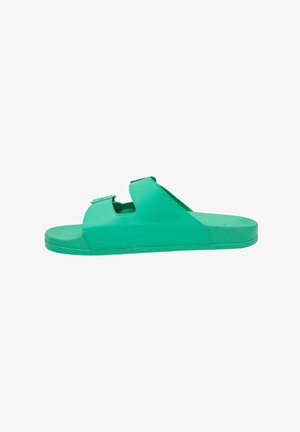 Green leather slide sandal with two adjustable straps, flat sole, and smooth texture. Features a rounded toe and minimalistic design.