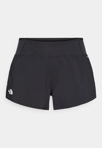 Μαύρες αθλητικές βερμούδες με φαρδύ ελαστικό κομμάτι στη μέση, που διαθέτουν τρυπητές λεπτομέρειες στο τελείωμα, φτιαγμένες από ελαφρύ, αναπνεύσιμο ύφασμα.