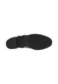 Semelle de chaussure en cuir noir avec une poignée en caoutchouc texturé. Présente un léger talon et un design à bout pointu. Bords renforcés pour plus de durabilité.