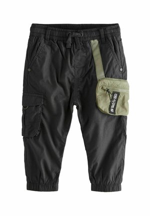 Black cargo pants with an elastic waistband, cuffed hems, and a green side pocket featuring a zip and logo tag. Lightweight, breathable material.