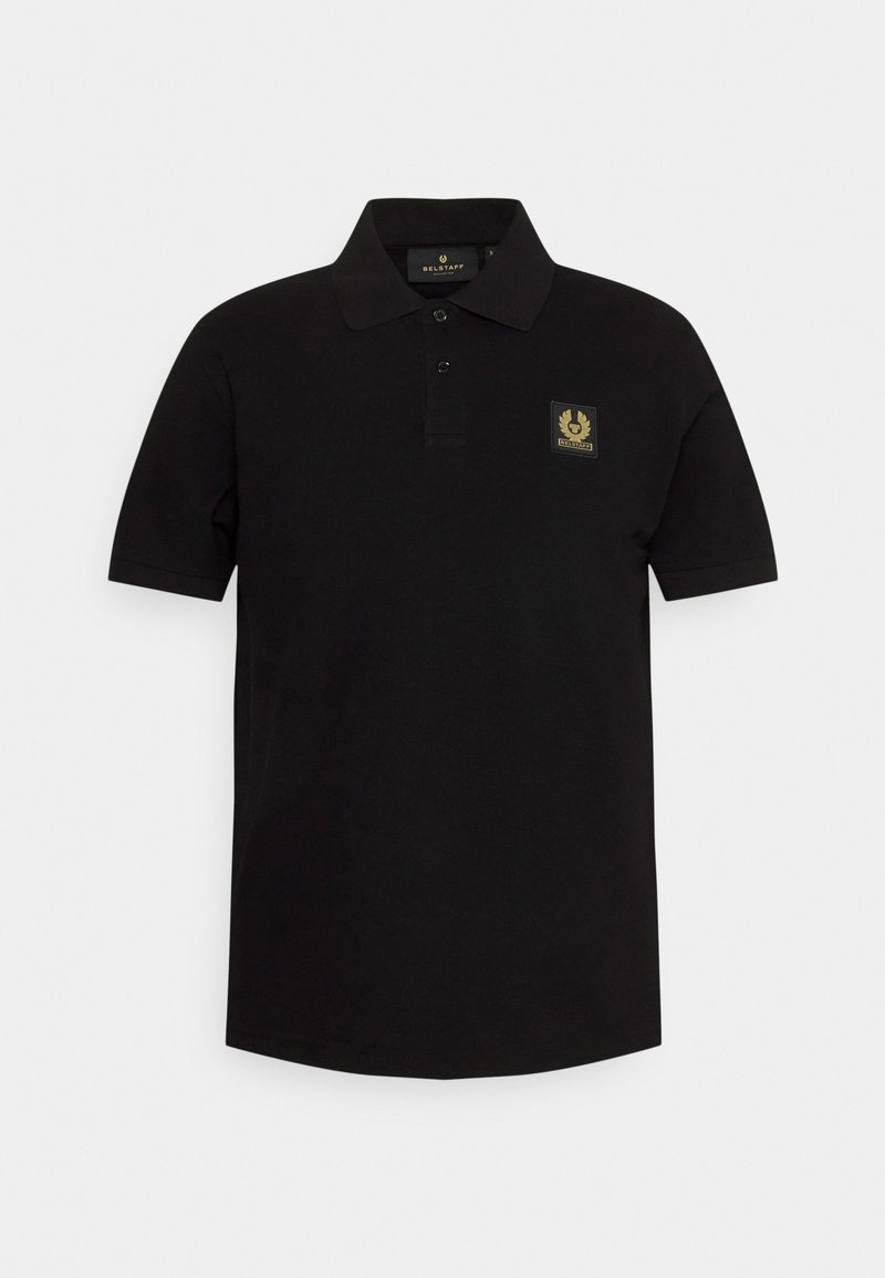 Black polo shirt made of cotton, featuring a collar and three buttons at the placket. A gold logo patch on the left chest adds detail.