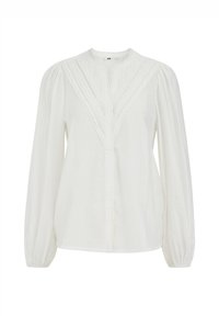 Blouse blanche à manches longues avec un design plissé, un col arrondi et des poignets froncés. Fabriquée en tissu léger et texturé.