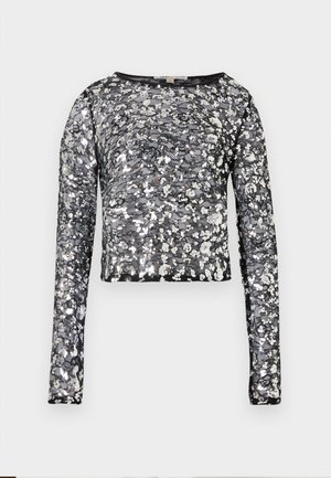 Crop top nero a maniche lunghe con paillettes floreali argento e base in rete trasparente, caratterizzato da un collo rotondo.