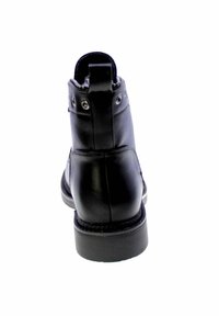 Stivale alla caviglia in pelle nera con una superficie liscia, punta arrotondata, occhielli laterali e una linguetta sul retro. Suola in gomma resistente.