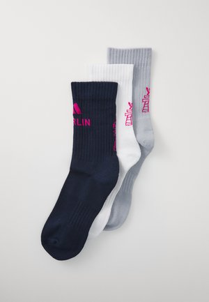 Three pairs of knee-length socks: dark navy, white, and light gray. Each features ribbed texture with pink logos and accents.