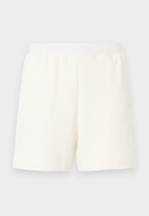 Shorts à genoux de couleur blanc cassé avec une ceinture élastique et sans poches visibles, présentés sur un fond clair uni.