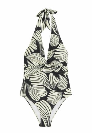 Maillot de bain une-pièce noir et blanc à col halter avec grand motif de feuilles et détail torsadé à l'avant.
