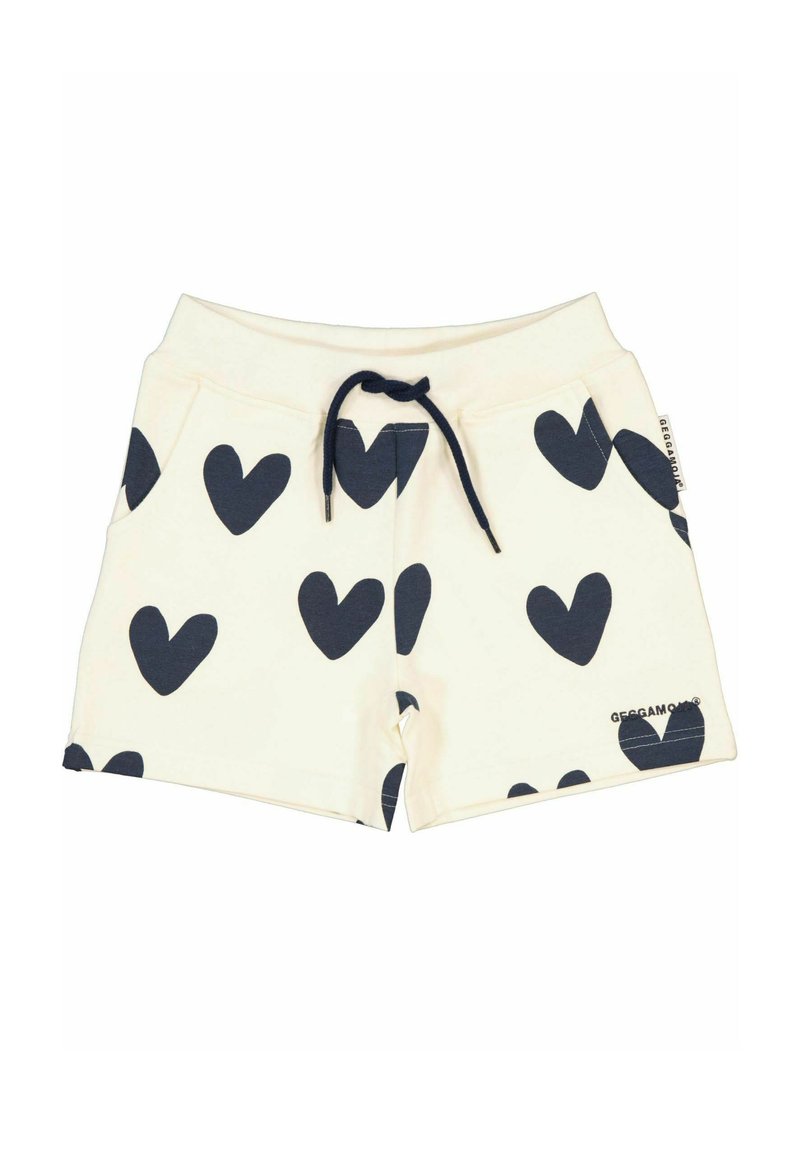 Bomullsshorts med krämfärgad bakgrund och marinblå hjärttryck, med dragsko i midjan och sidofickor. Märkesetikett vid fållen.