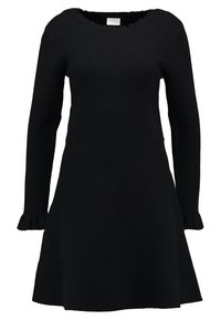 Vestito nero lavorato a maglia con maniche lunghe, gonna a campana e scollatura ondulata. Caratterizzato da un corpino aderente e polsini arricciati. Morbido al tatto.